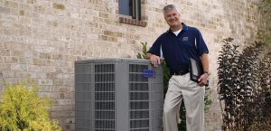 HVAC contractor and business owner with AC unit