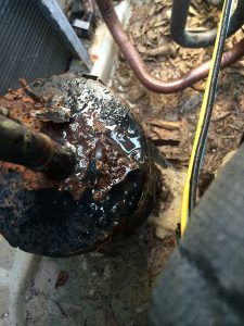 Rusted and Leaking Refrigerant Accumulator